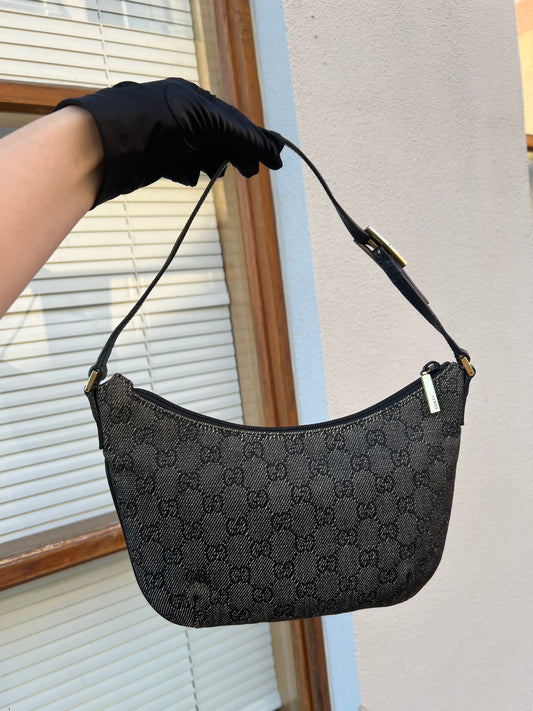Pre-loved Gucci monogram bag in denim with gold toned hardware. Circa 2000s.