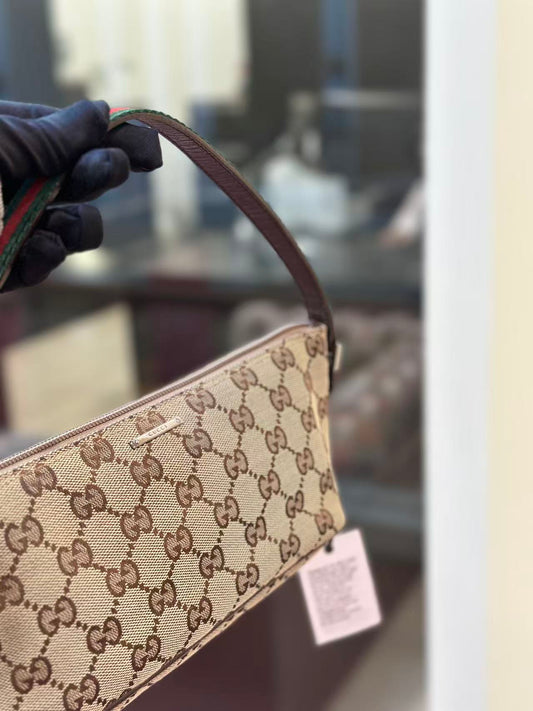 Pre-loved Gucci vintage GG Canvas Boat Baguette Bag