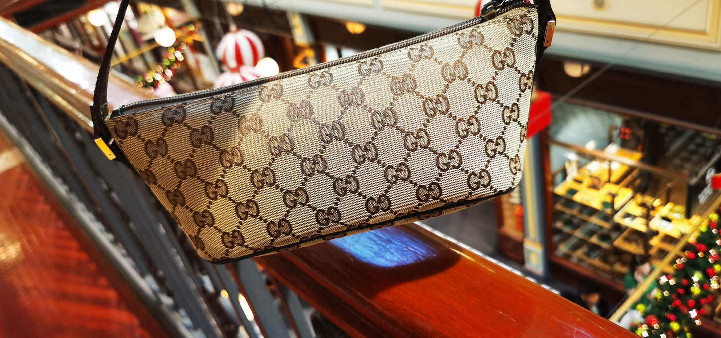 Pre-loved Gucci vintage GG Canvas Boat Baguette Bag