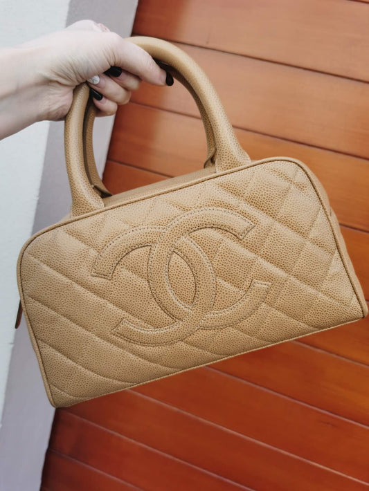 Pre-loved Chanel Vintage Beige Caviar Handbag