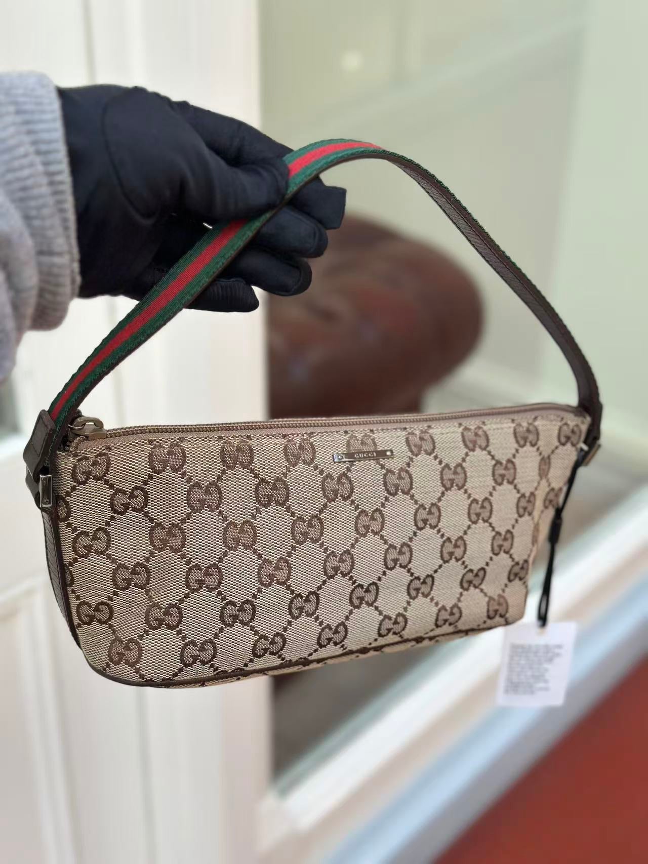 Pre-loved Gucci vintage GG Canvas Boat Baguette Bag