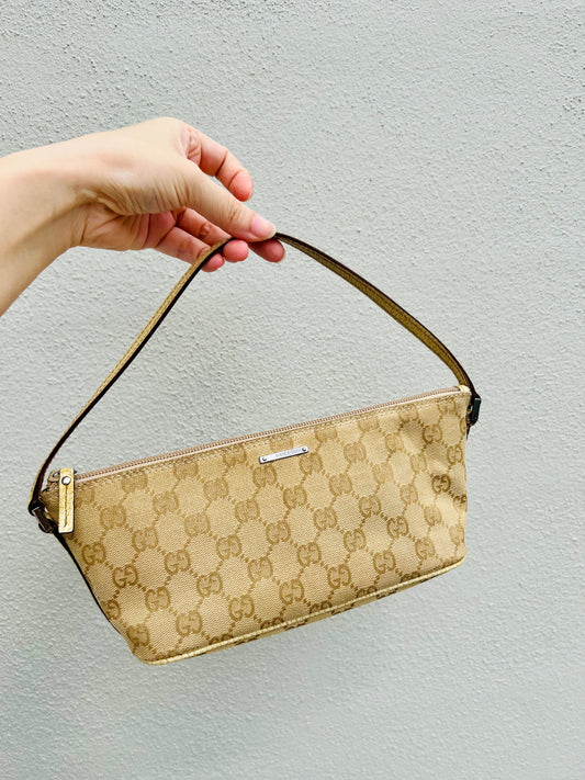 Pre-loved Gucci vintage GG Canvas Boat Baguette Bag Soft Lemon Sorbet Tone
