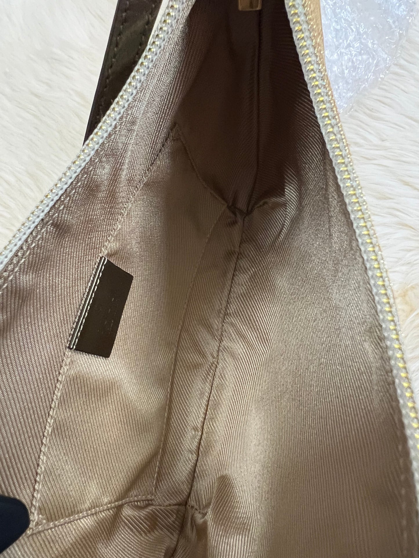 Pre-loved Gucci Vintage Light Gold Monogram Bag